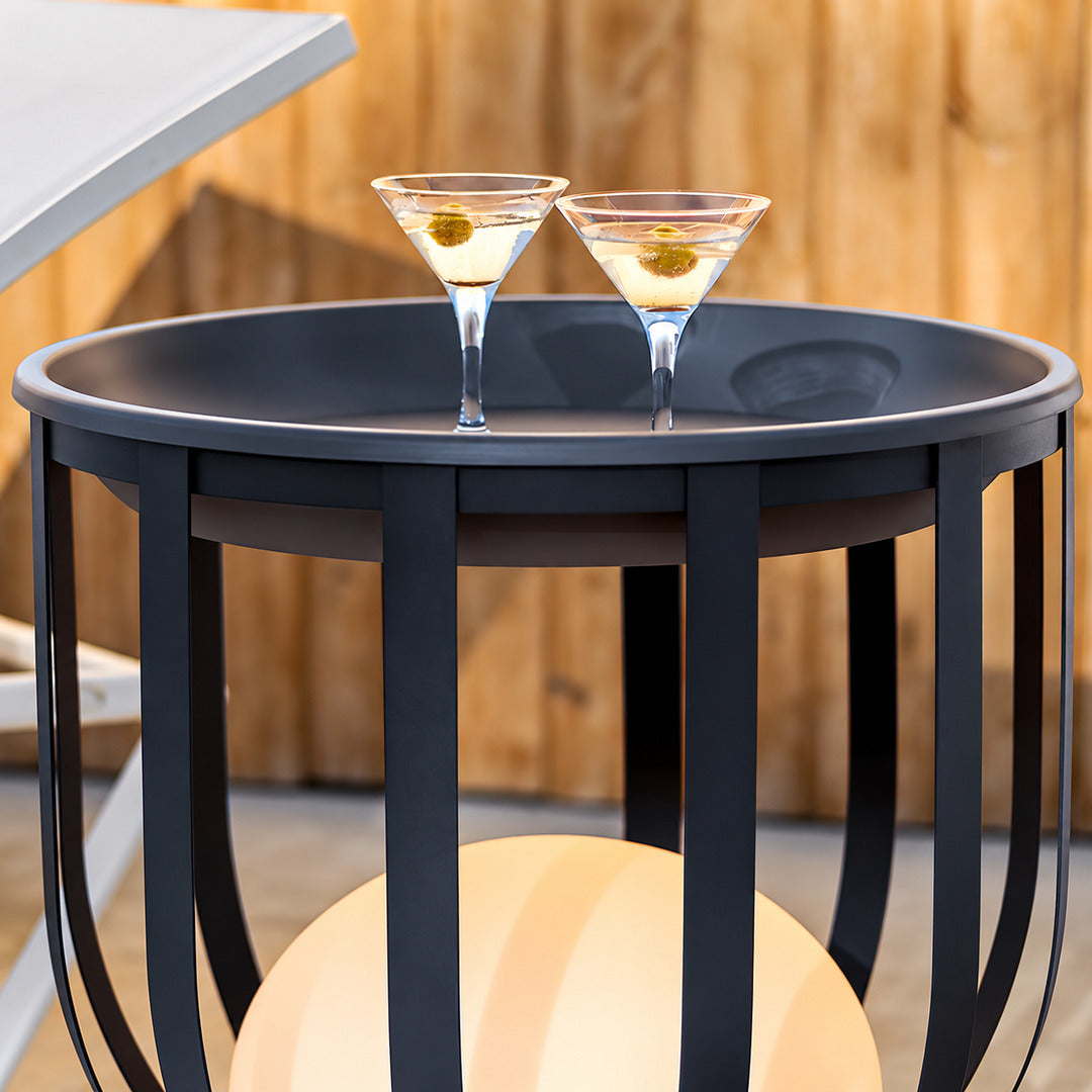 Faceta outdoor garden light shown with an optional planter tray holding greenery