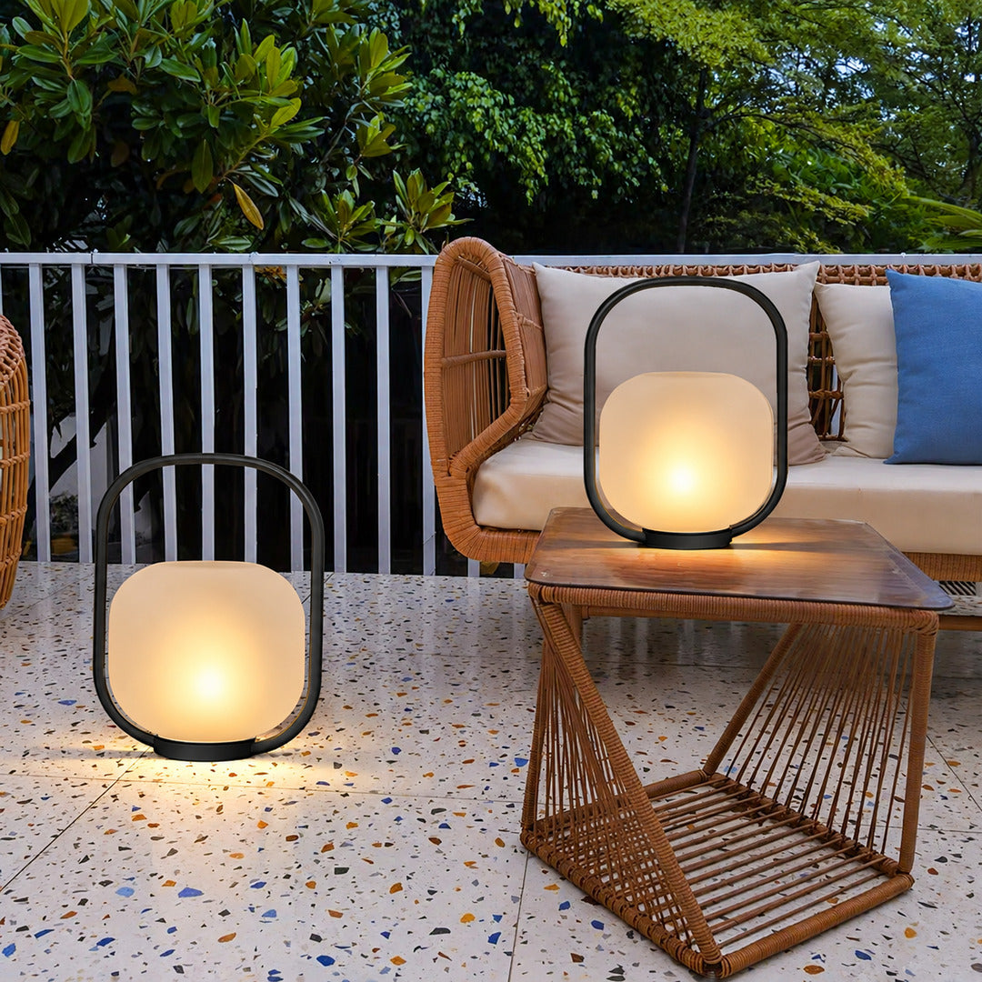 Falo portable lantern adding a cozy warm glow to a backyard deck gathering