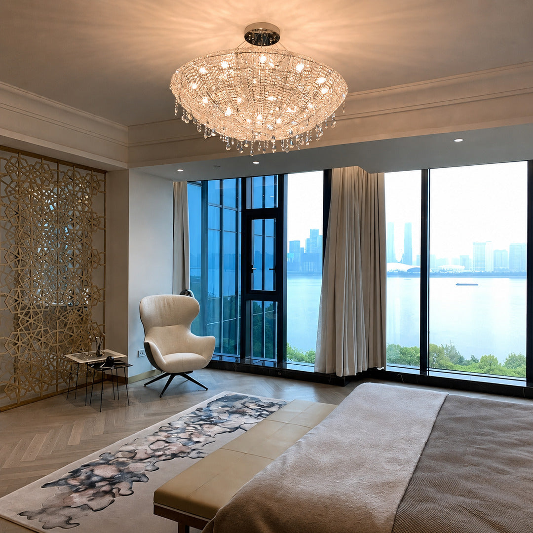 Fiocco crystal chandelier creating a glamorous glow in a primary bedroom