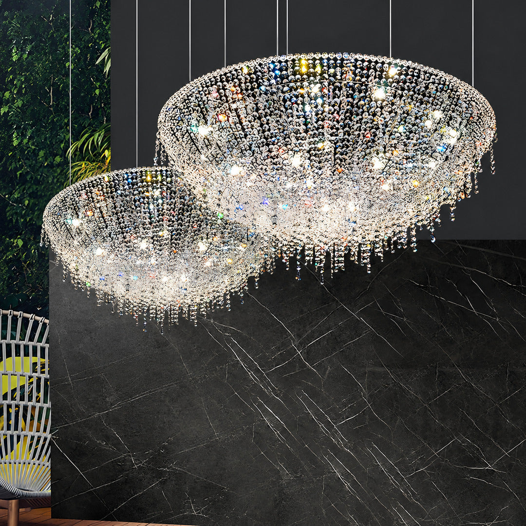 Warm light sparkling through the crystal tassels of the Fiocco chandelier