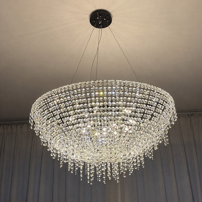 Fiocco crystal chandelier creating a glamorous glow in a primary bedroom