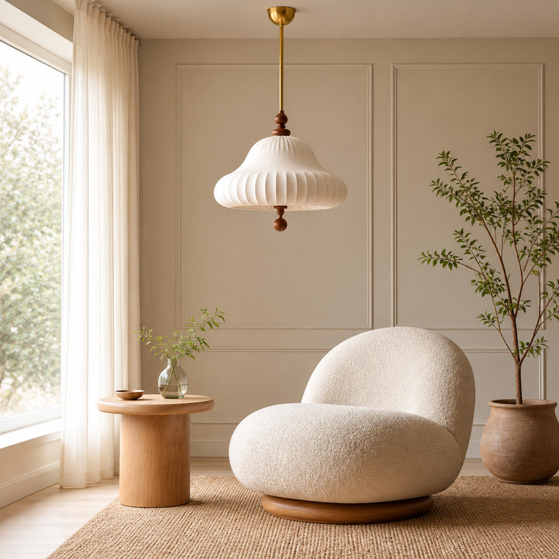 Fiorita blooming flower pendant casting a warm glow over a cozy corner reading nook