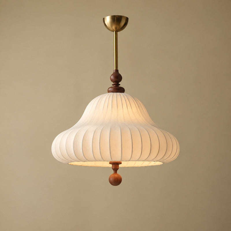 Gold and white Fiorita blooming flower pendant light centered over a dining table
