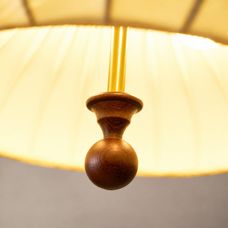 Warm glow diffusing softly through the layered petals of the Fiorita pendant light