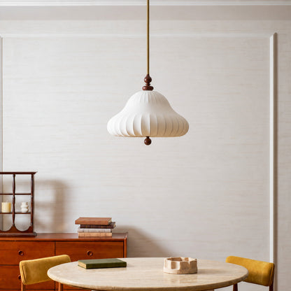 Fiorita blooming flower pendant casting a warm romantic glow over an elegant dining table