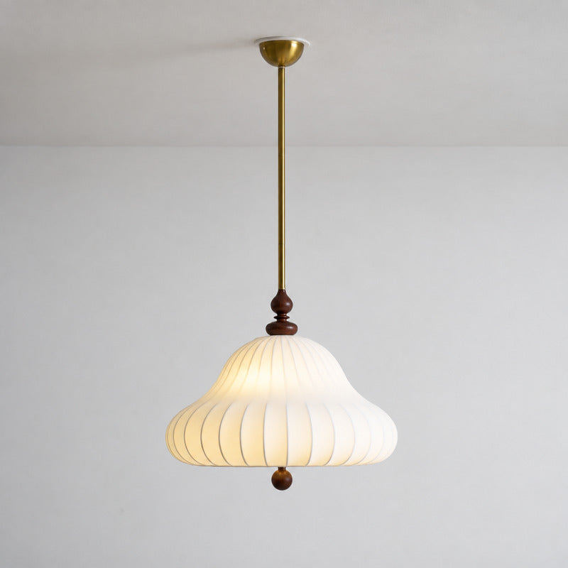Warm glow diffusing softly through the layered petals of the Fiorita pendant light