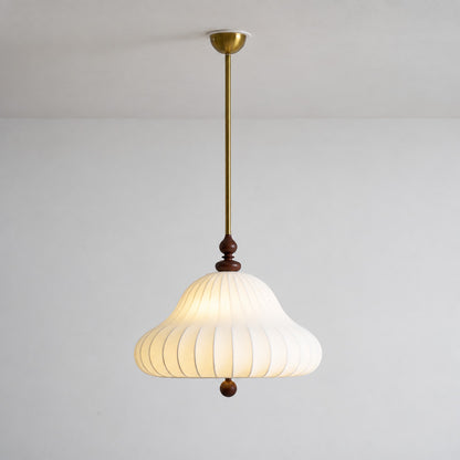 Warm glow diffusing softly through the layered petals of the Fiorita pendant light