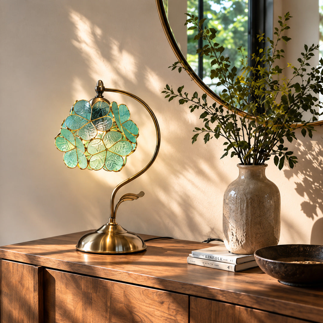 Foglia glass leaf table lamp adding a warm decorative accent to an entryway console