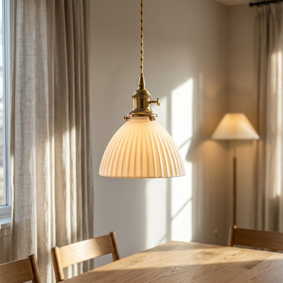 Freya trio three pleated ceramic pendants above long dining table Nordic Scandinavian rectangular minimalist interior