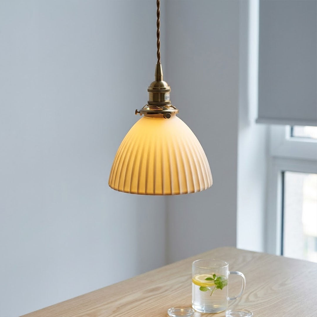 Freya single pleated ceramic pendant over kitchen sink modern Nordic Scandinavian white countertop warm glow interior