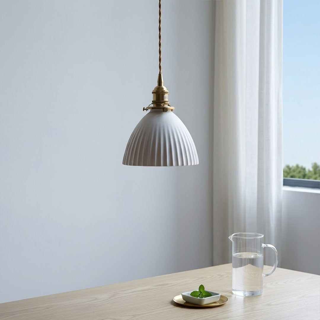 Freya single pleated ceramic pendant over kitchen sink modern Nordic Scandinavian white countertop warm glow interior