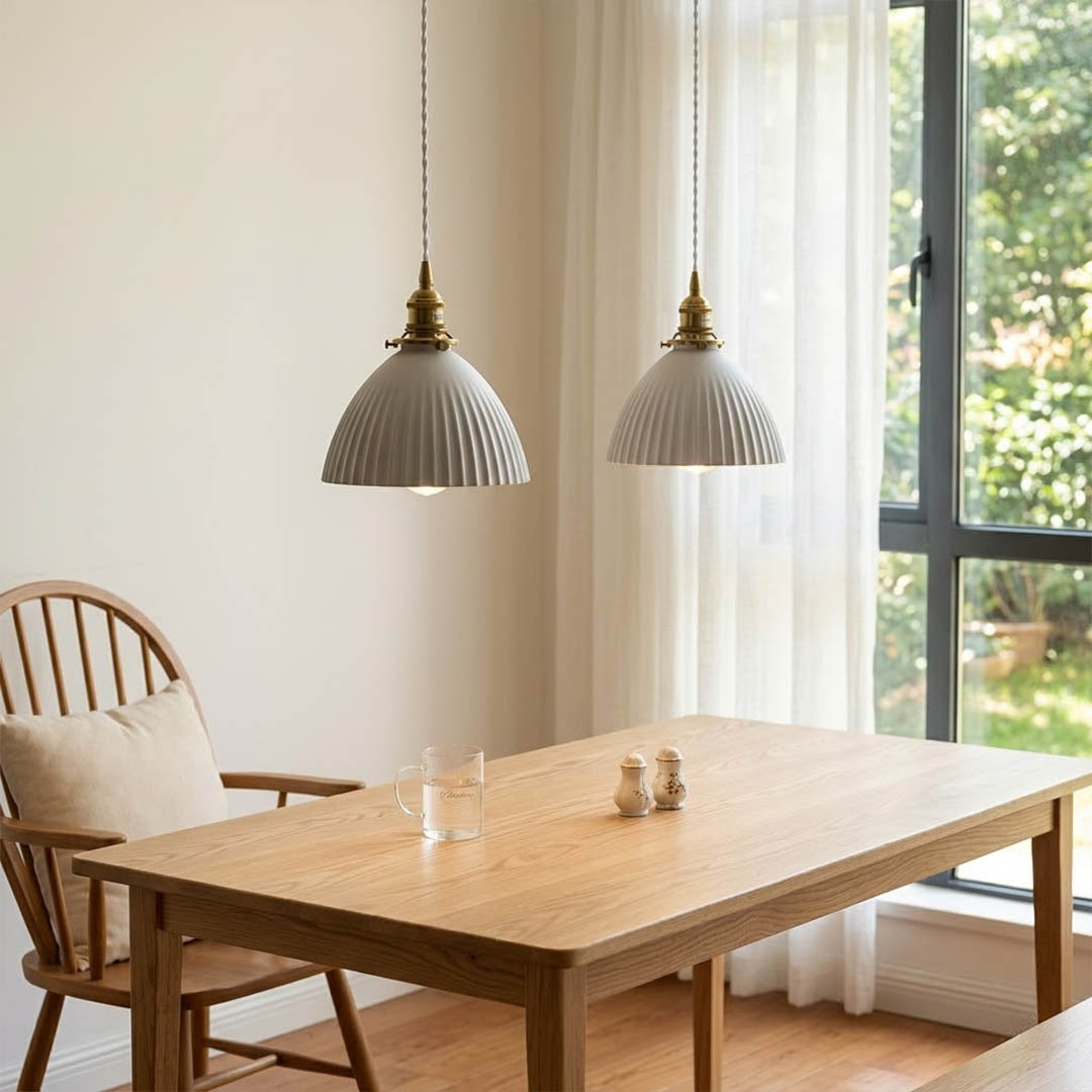 Freya Set of 2 pleated ceramic pendants pair above kitchen island Nordic Scandinavian minimalist white interior warm glow