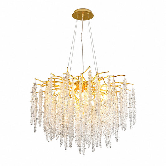 Fronda gold crystal chandelier with branching arms and cascading clear crystal strands over a dining table