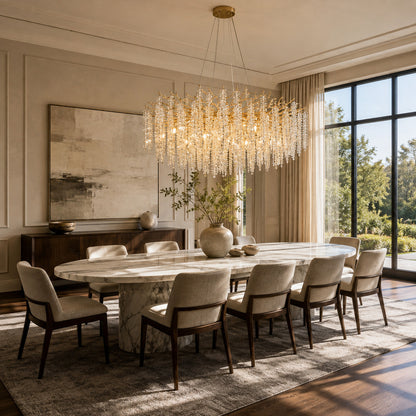 Fronda gold crystal chandelier sparkling above a dining room table