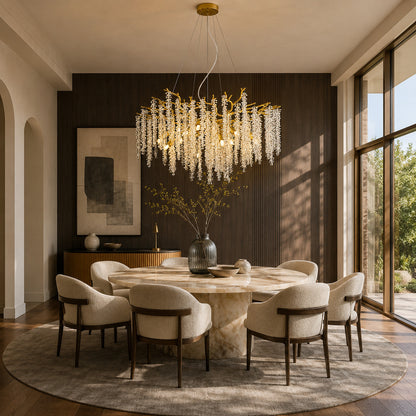 Fronda gold crystal chandelier sparkling above a dining room table