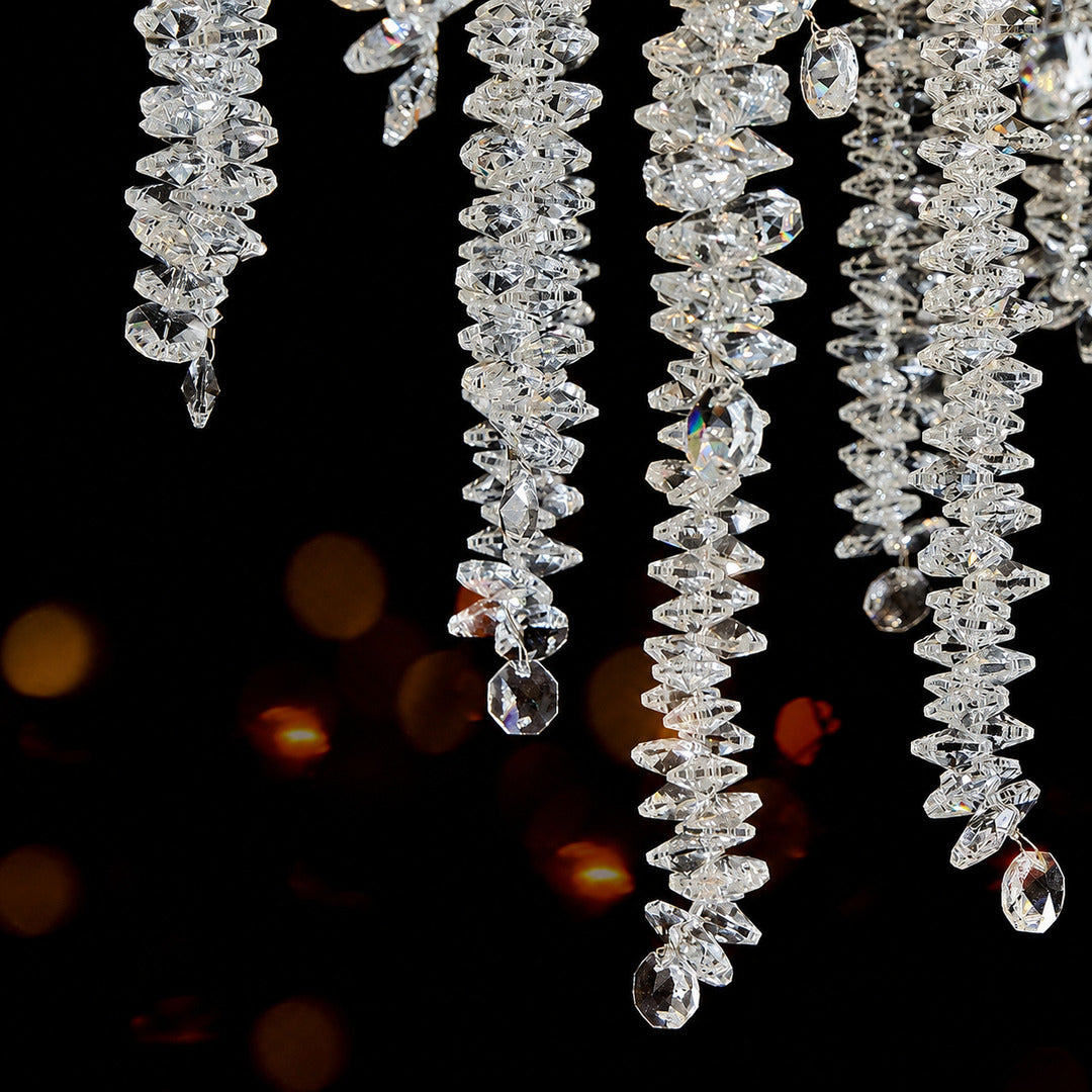 Close-up of the clear crystal strands hanging from the Fronda chandelier
