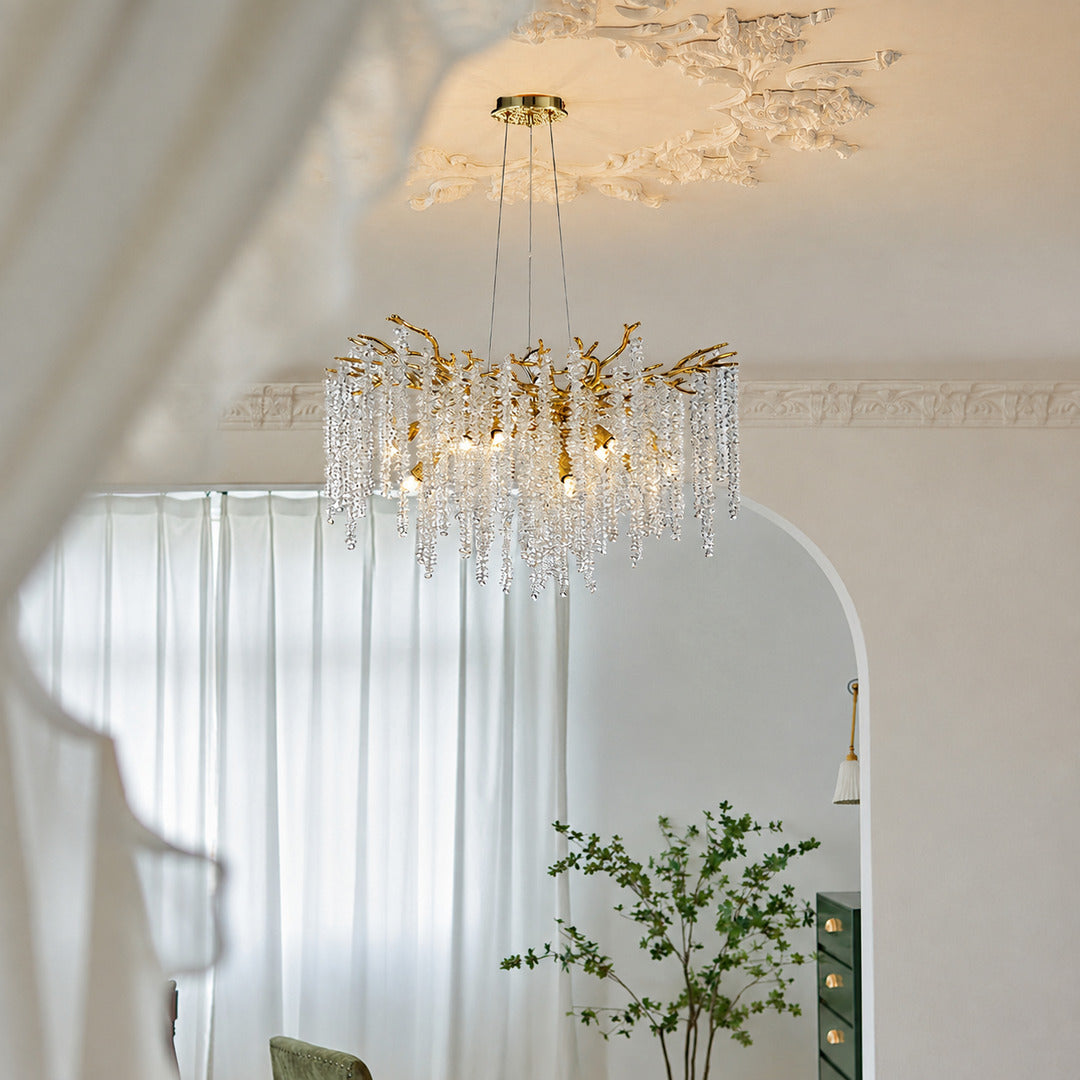 Fronda gold crystal chandelier adding glamour to a living room
