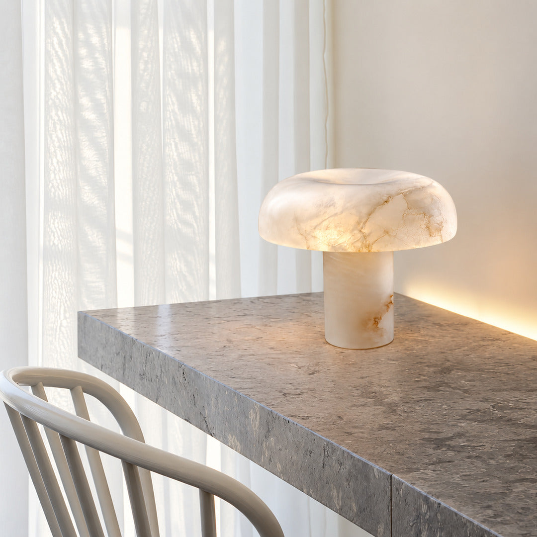 Fungo alabaster mushroom lamp lighting a home office desk