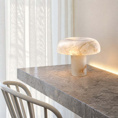 Fungo alabaster mushroom lamp lighting a home office desk