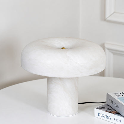 Close-up of the milky white alabaster dome of the Fungo table lamp unlit
