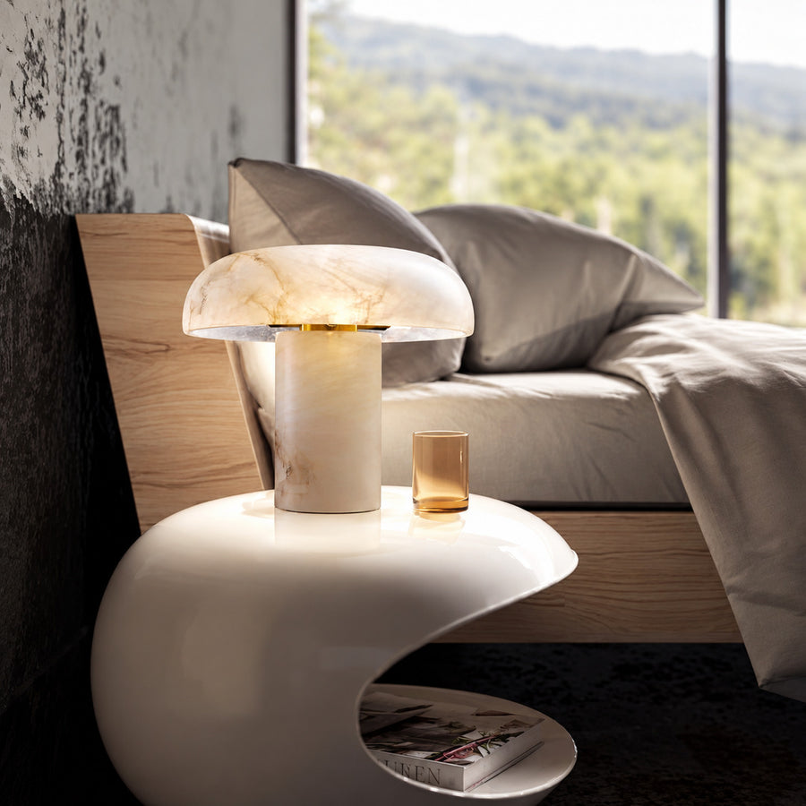 Fungo mushroom table lamp casting a cozy glow on a bedside table