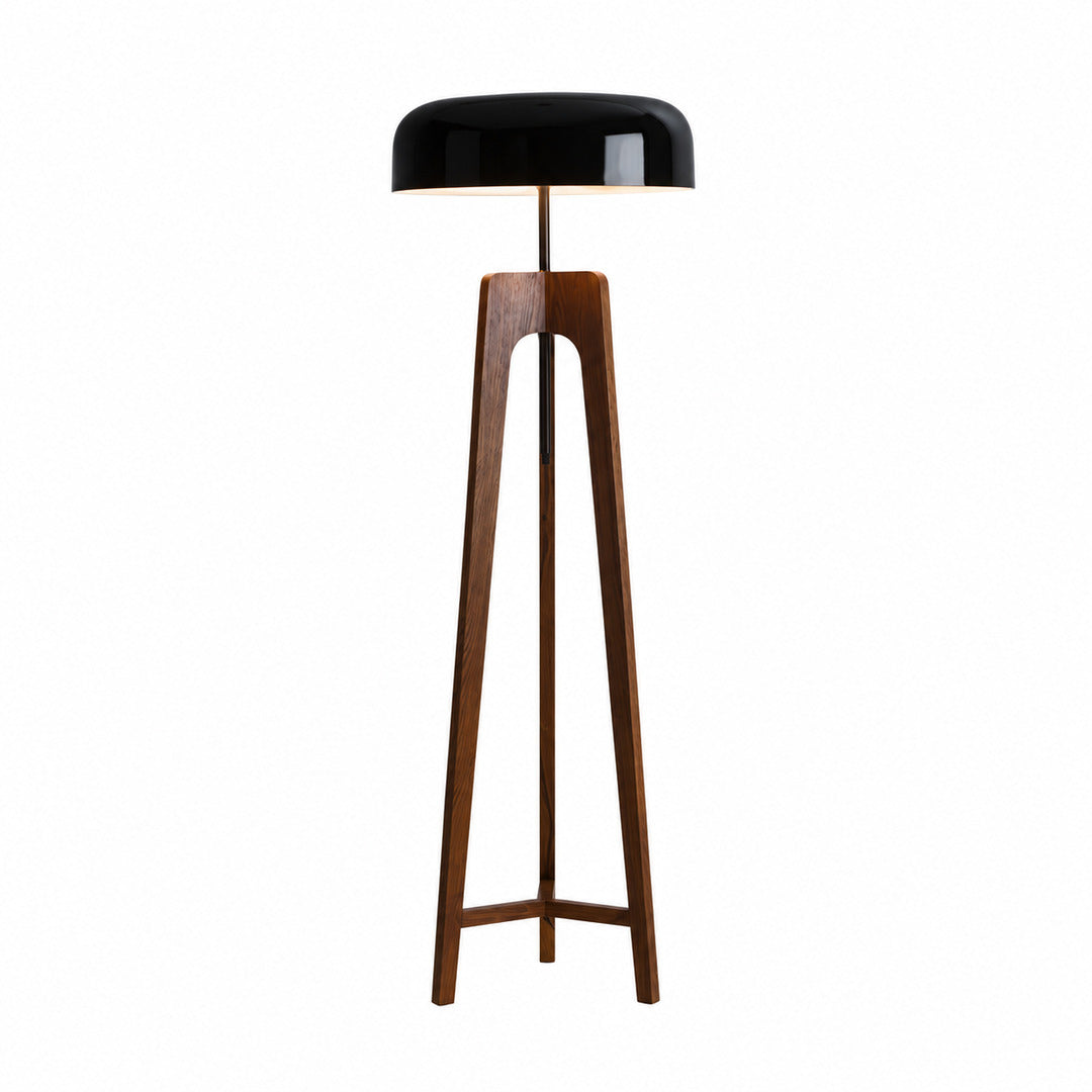 Fungo wood floor lamp with a handmade wood tripod base and a mushroom shade glowing warm in a living room