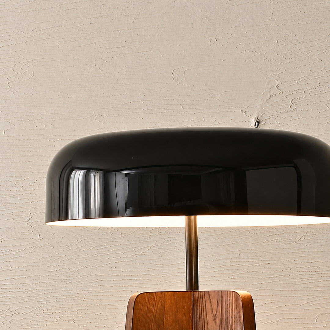 Detail of the mushroom-shaped shade on the Fungo wood floor lamp directing soft light downward