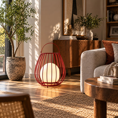 Gabbia rechargeable lantern adding a warm portable glow to an indoor living room corner