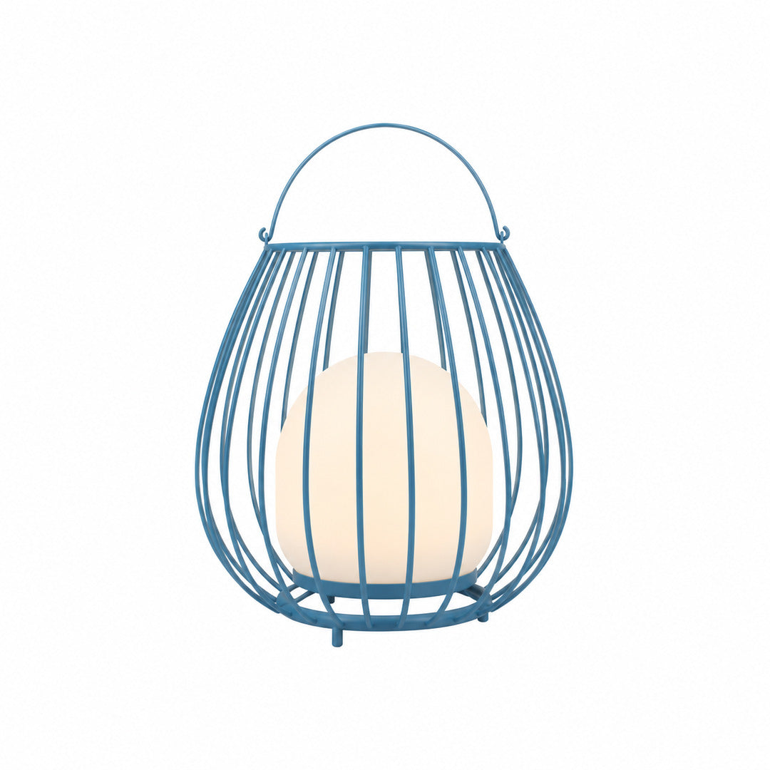 Blue Gabbia rechargeable lantern adding a cool colorful glow to a garden bench