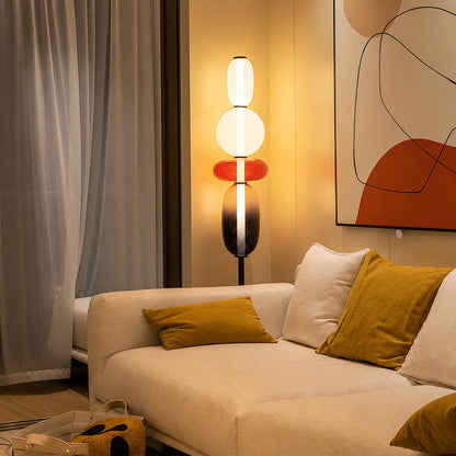 Gemma stacked glass floor lamp Model A red modern living room beside sofa hand-blown art glass sculptural warm glow American home lifestyle interior