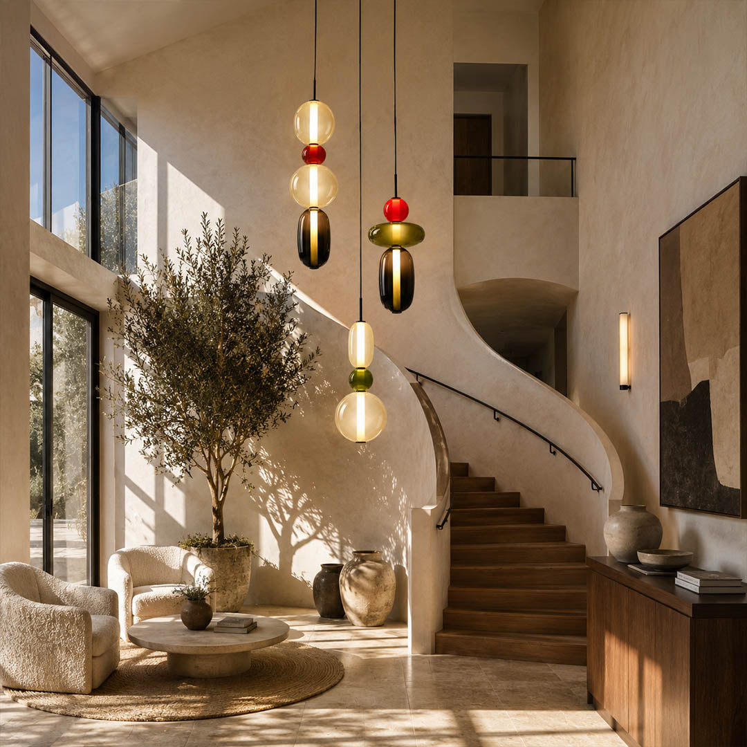 Gemma stacked glass pendant light colorful cluster staircase stairwell different heights hand-blown art glass vibrant statement American home lifestyle interior