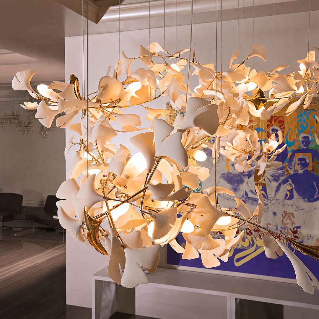 Gingko Chandelier Style I illuminated warm G9 evening ambient glow ceramic leaves soft light vertical cascade atmospheric detail close up mid century