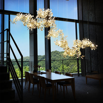 Gingko Chandelier Style I linear vertical 137 inch luxury retail flagship showroom architectural sculptural mid century modern botanical statement commercial warm ambient lifestyle interior
