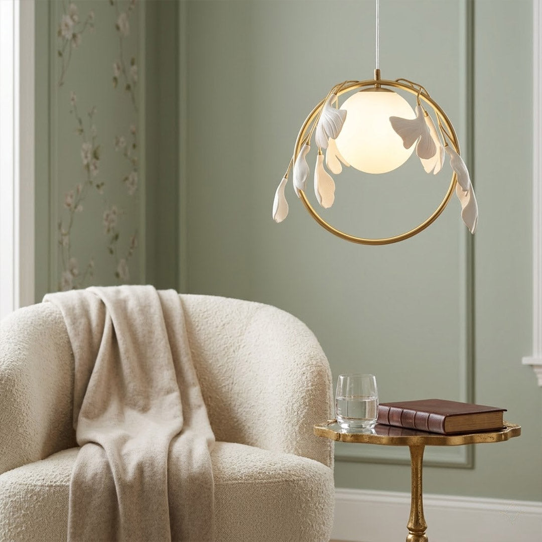 Ginkgo botanical pendant centered above master bed Japandi bedroom soft filtered glow neutral natural interior