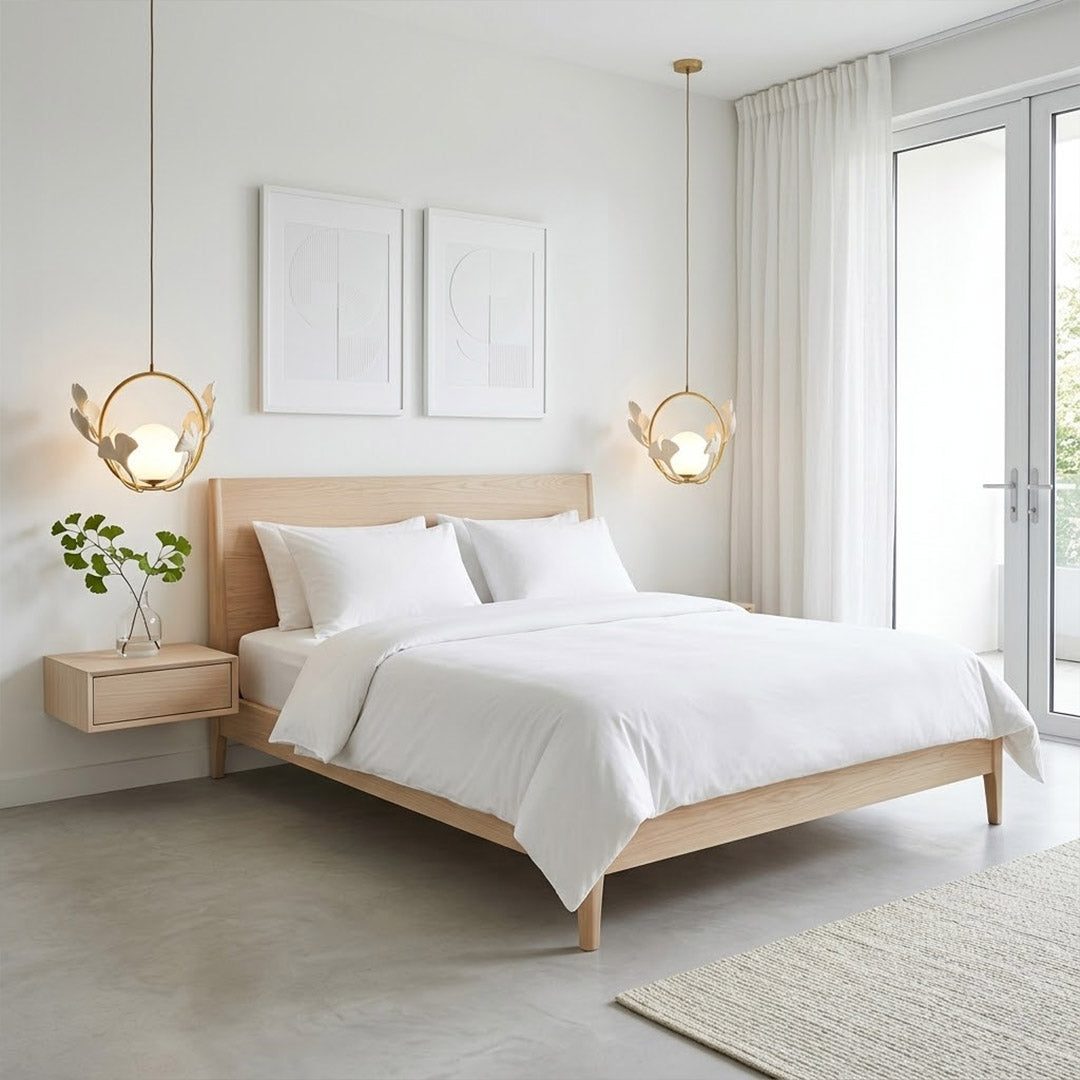 Ginkgo botanical pendant centered above master bed Japandi bedroom soft filtered glow neutral natural interior