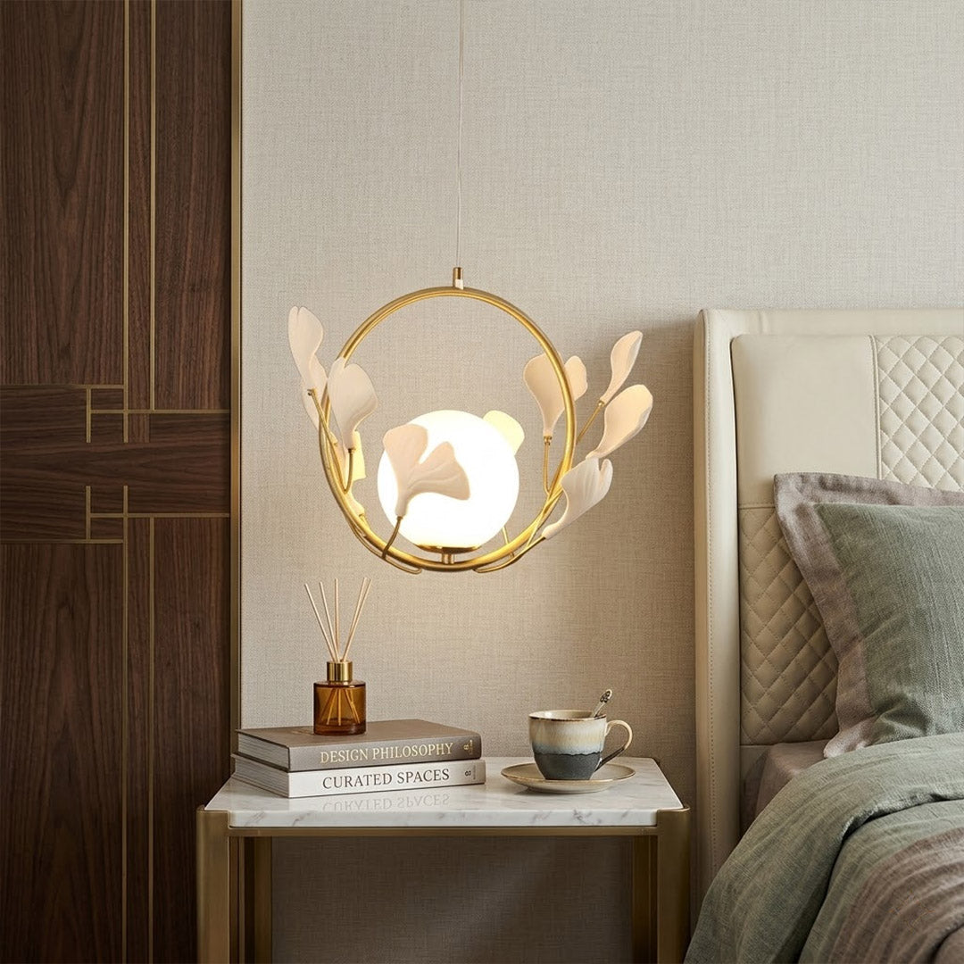 Ginkgo botanical pendant centered above master bed Japandi bedroom soft filtered glow neutral natural interior