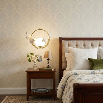 Ginkgo botanical pendant centered above master bed Japandi bedroom soft filtered glow neutral natural interior