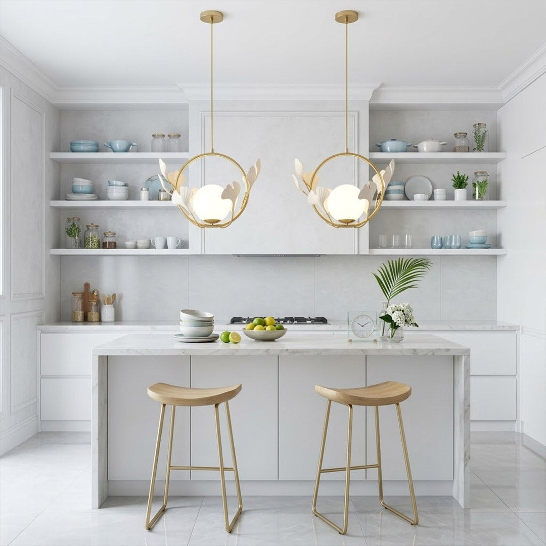 Ginkgo botanical pendant hanging above oval dining table Japandi interior warm glow porcelain leaves brass halo