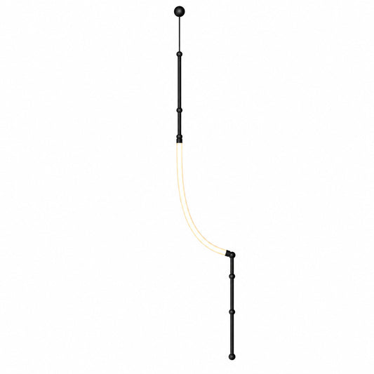 Giunco floor-to-ceiling lamp with a matte black bamboo-style iron pole and curved silicone LED tube on a white background