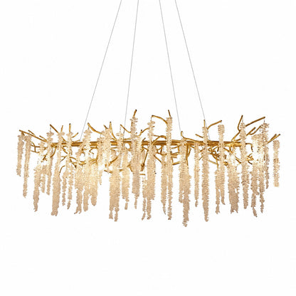 Glicine wisteria crystal chandelier with cascading clear crystal glass drops on a gold frame over a dining table