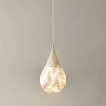 Small 5.9-inch Goccia alabaster raindrop pendant over a breakfast nook or bedside table