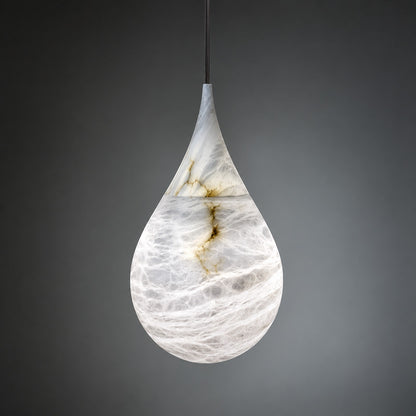 Warm glow diffusing softly through the raindrop alabaster shade of the Goccia pendant