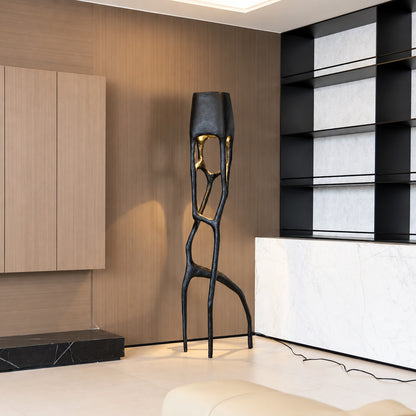 Gotica sculpture floor lamp filling a living room corner with a warm sculptural glow