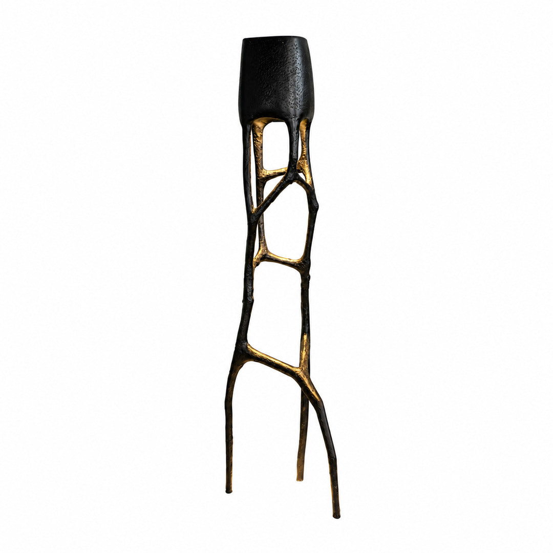 Black Gotica sculpture floor lamp as a bold avant-garde statement beside a living room sofa