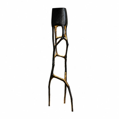 Black Gotica sculpture floor lamp as a bold avant-garde statement beside a living room sofa