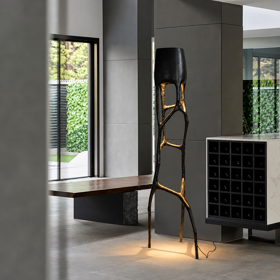 Gotica sculpture floor lamp as a dramatic artistic focal point in a boutique hotel lobby