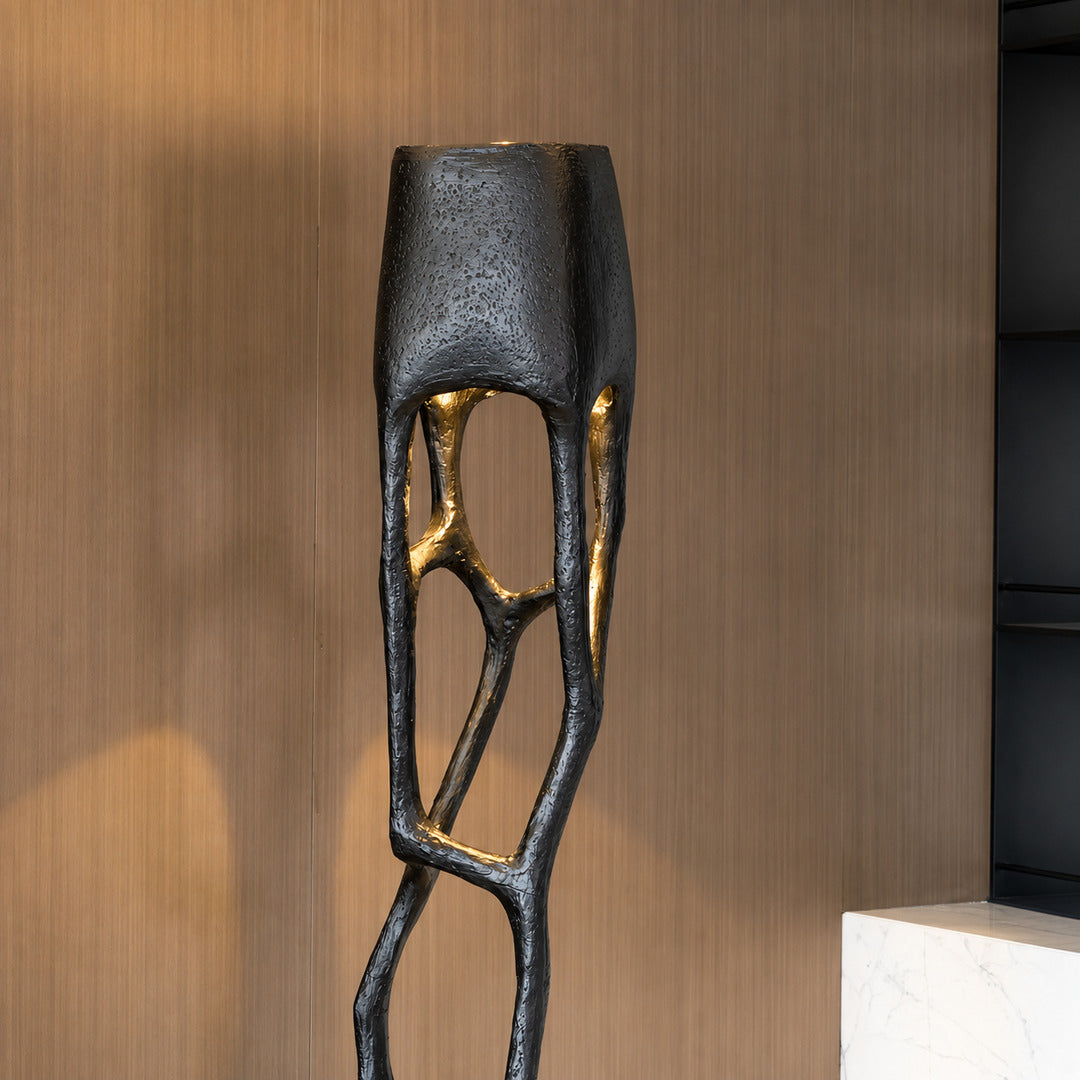 Close-up of the intricate hand-crafted web-like sculptural base of the Gotica floor lamp