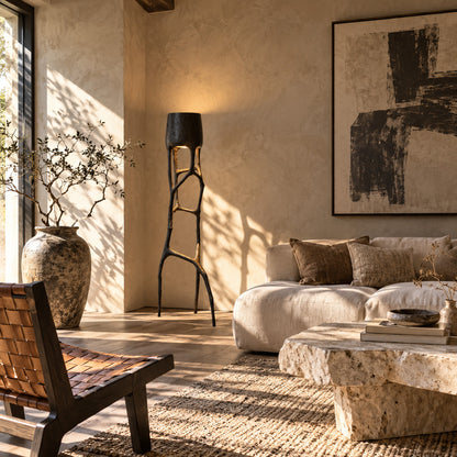 Gotica sculpture floor lamp filling a living room corner with a warm sculptural glow