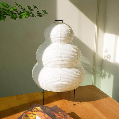 Washi paper gourd lantern table lamp displayed in natural sunlight showing texture and elegant minimalist design