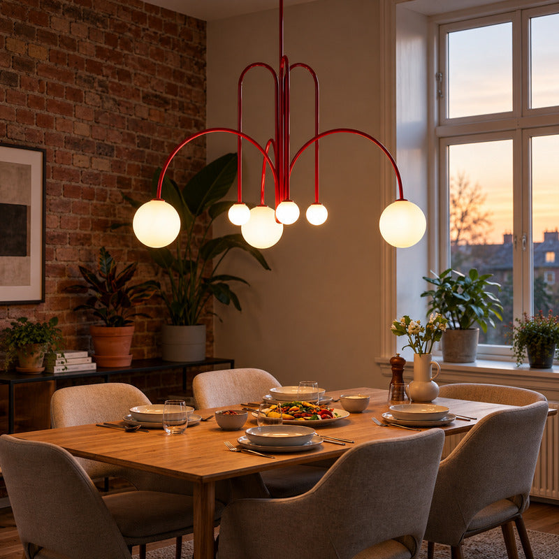 Gran Finale glass chandelier casting warm light over an elegant dining room table